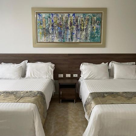 Hotel Royal Elim Internacional Cali Exterior foto A room at the hotel