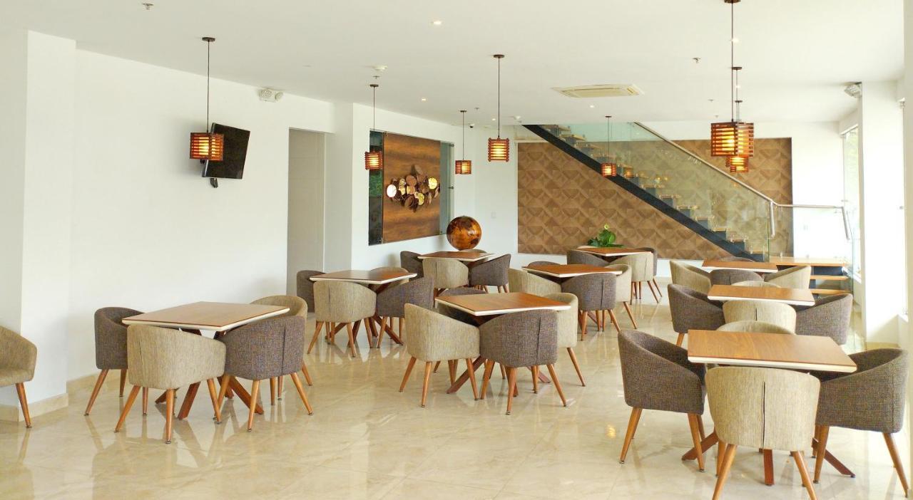 Hotel Royal Elim Internacional Cali Exterior foto The interior of the restaurant