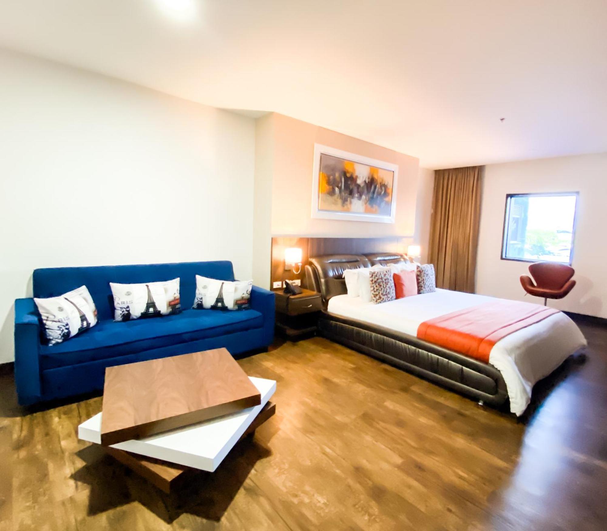 Hotel Royal Elim Internacional Cali Exterior foto A room at the hotel