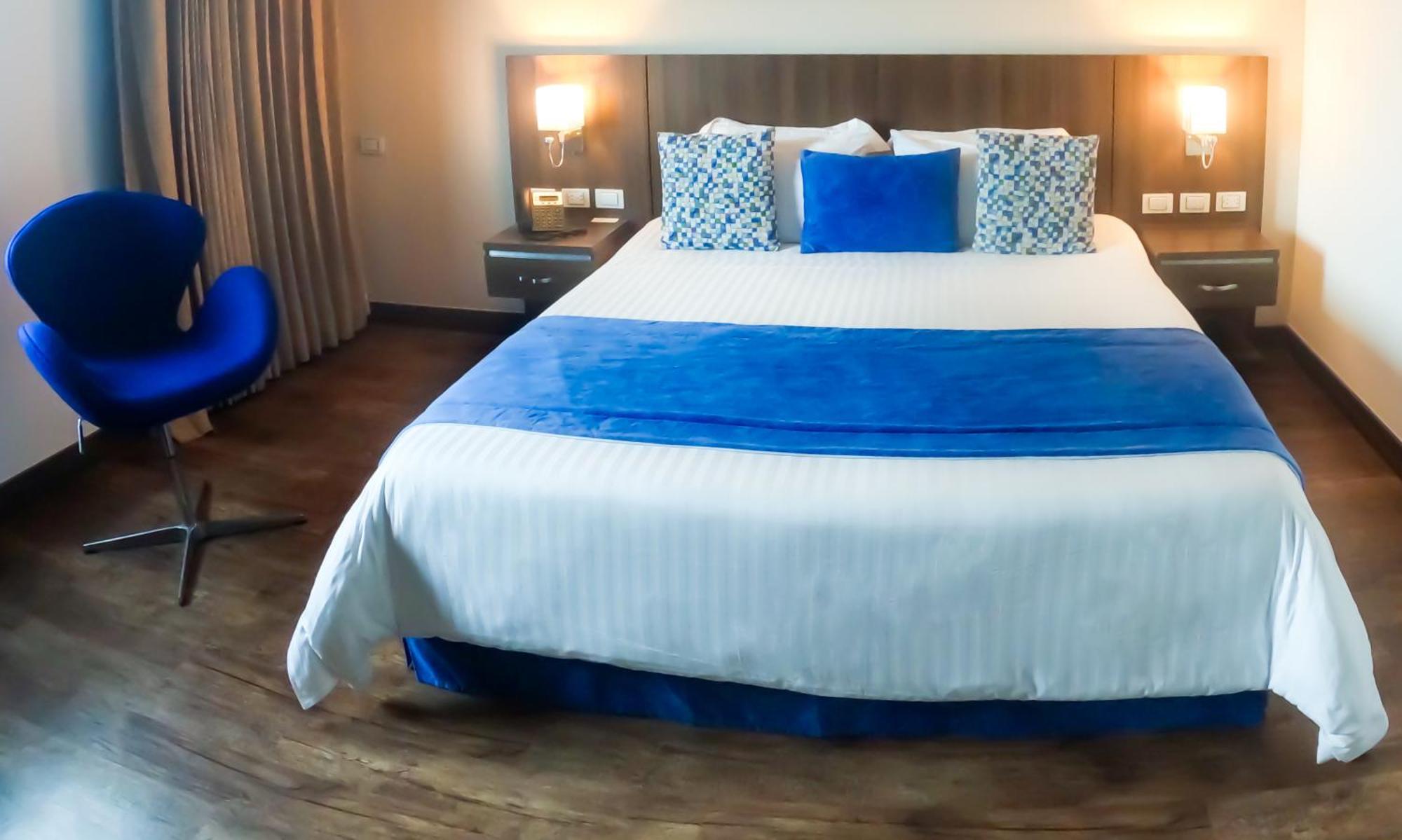 Hotel Royal Elim Internacional Cali Exterior foto A bedroom at the hotel